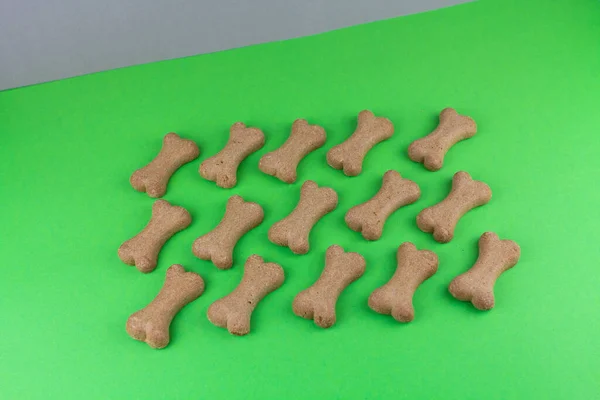 a dog food bones on green background pattern