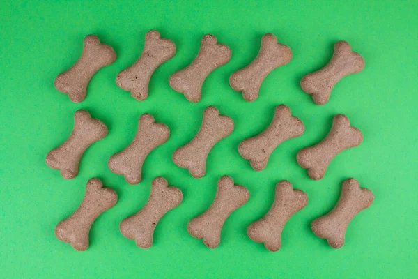 a dog food bones on green background pattern