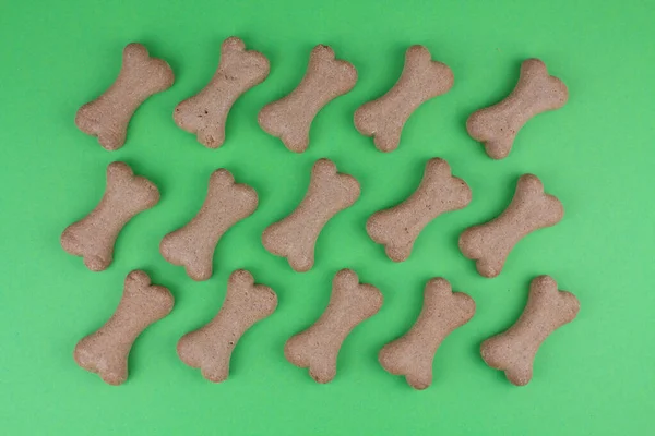 a dog food bones on green background pattern