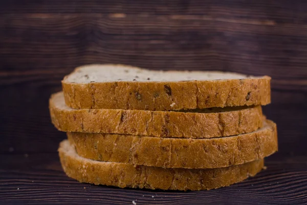 Sliced Bread Dark Wood Table — Stock Photo, Image