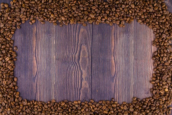 Uma Armação Feita Grãos Café Uma Mesa Madeira — Fotografia de Stock