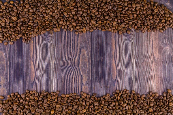 a frame made of coffee beans on a wooden table