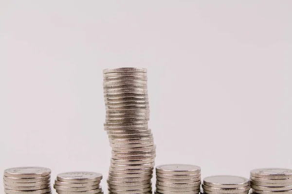 a money coins in stocks on a white background