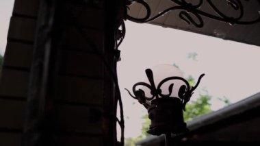 beautiful street lamp on the wall of the house