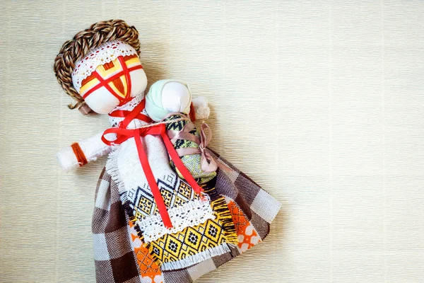 Handmade textile doll, rag doll \'Motanka\' in ethnic style, ancient culture folk crafts tradition of Ukraine. Are Most Popular Souvenirs From Ukraine.