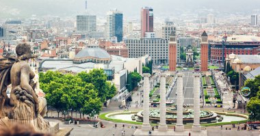 BARCELONA, SPAIN - JULY 28: View from Montjuic to Plaza de Espana (Plaza d'Espanya) including the four columns and the Venetian towers in Barcelona, Spain. July 28, 2015 in Barcelona, Spain.