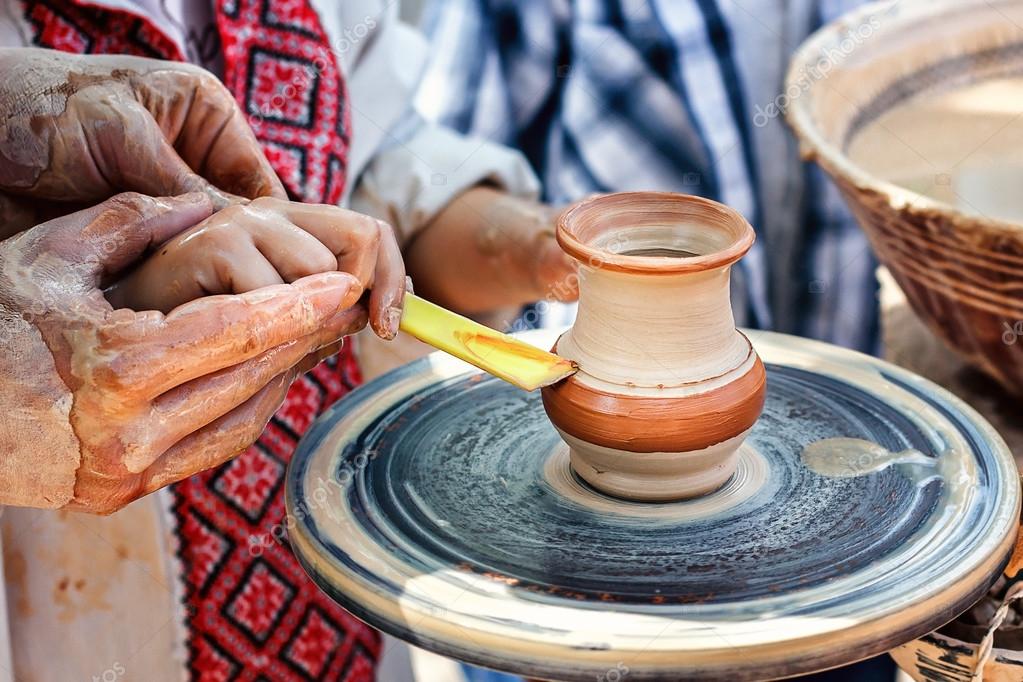 Hands working on pottery wheel. Sculptor, Potter. Human Hands