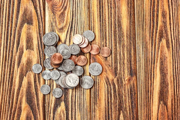 Top view of U.S. coins on old wooden background with copy space. — Stock Photo, Image