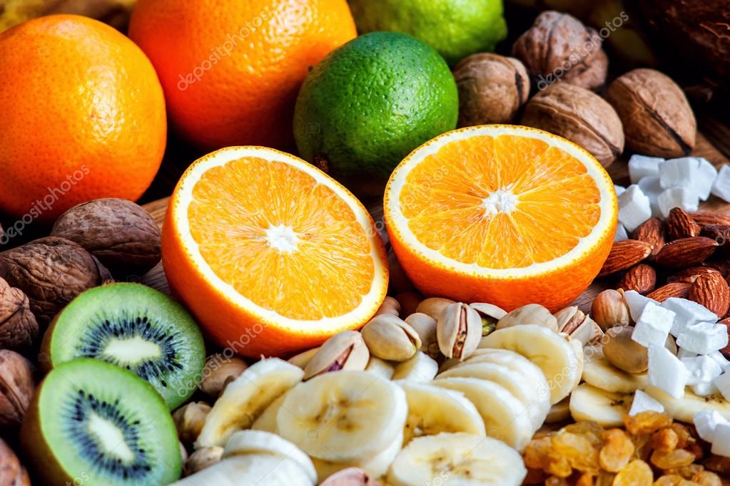 Fresh fruits. Healthy food. Mixed fruits and nuts background.Healthy