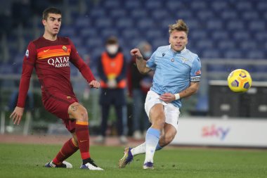ROME, İtalya - 15.01.2021: GIANLUCA MANCINI (ROMA), Ciro Immobile (LAZIO) İtalyan Serie A Ligi 2020-2021 futbol karşılaşması sırasında Roma 'daki Olimpiyat stadyumunda SS LAZIO AS ROMA' ya karşı