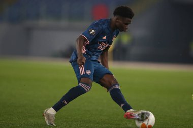 Roma, İtalya - 18 / 02 / 2021: Bukayo Saka (ARS), Roma 'daki Olimpiyat Stadyumu' nda BENFICA ile ARSENAL arasında oynanan 32 futbol karşılaşmasının UEFA EUROPE LeAGUE 20 / 21.