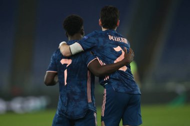 Roma, İtalya - 18 / 02 / 2021: Bukayo Saka (ARS), Roma 'daki Olimpiyat Stadyumu' nda oynanan BENFICA ile ARSENAL arasında oynanan 32 futbol karşılaşmasının UEFA Avrupa Liderliği 20 / 21 'inde golü attı.