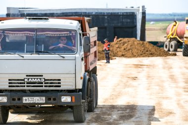Omsk, Russia - June 2: truck drive on road construction