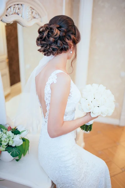 Bride holding bouguet of flowers — Stock Fotó