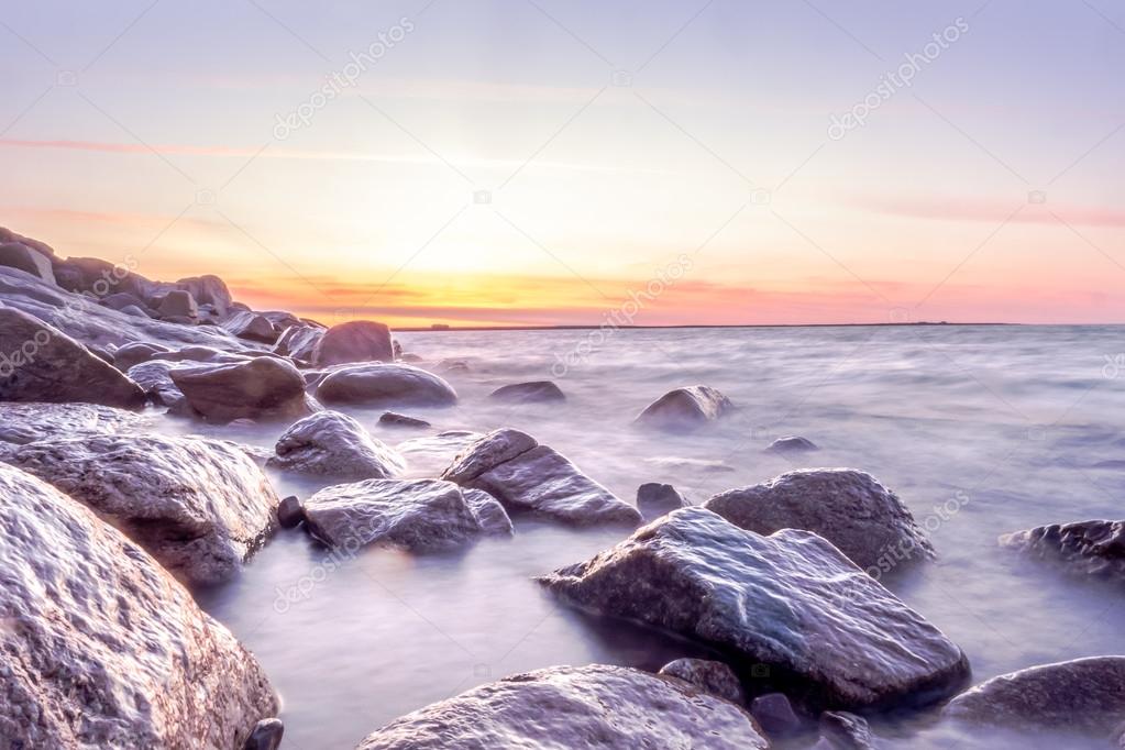 Seascape sunset at the rocky coast