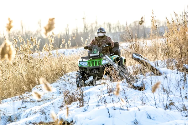 Quad bike on a winter in field off road — Stock Photo, Image