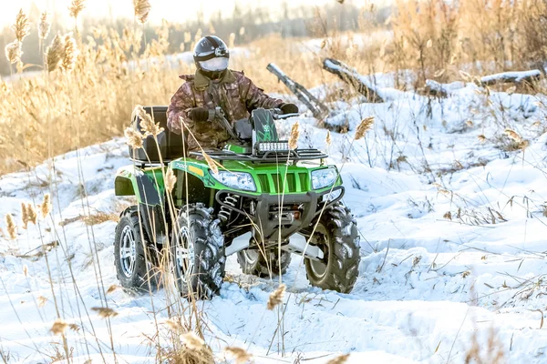 Quad bike on a winter in field off road — Stock Photo, Image