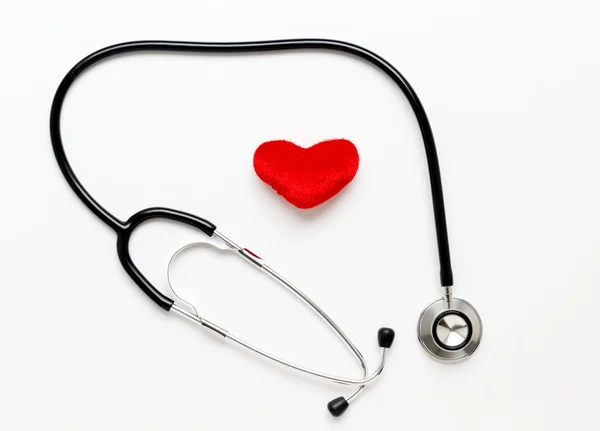 Stetoskop na bílém pozadí s plyšové srdce — Stock fotografie