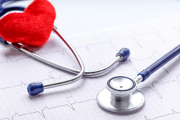 Stethoscope on white background with plush heart and cardiogram — Stock Photo, Image