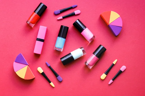Make up set on red background top view — Stock Photo, Image