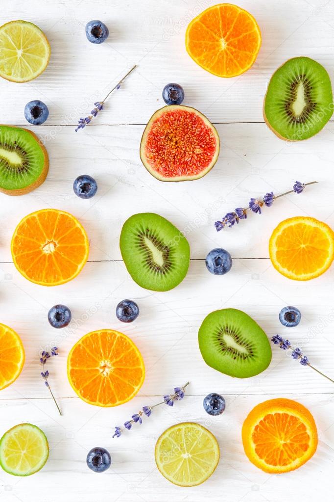 Colorful pattern made of halved fruits top view