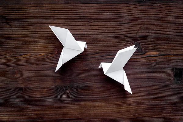 Origami pigeon. World Peace Day, care concept. Top view