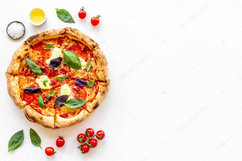 Food ingredients for cooking pizza - tomatoes cheese and basil