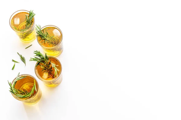 Summer cold tea and fresh herbs rosemary in glasses — Stock Photo, Image