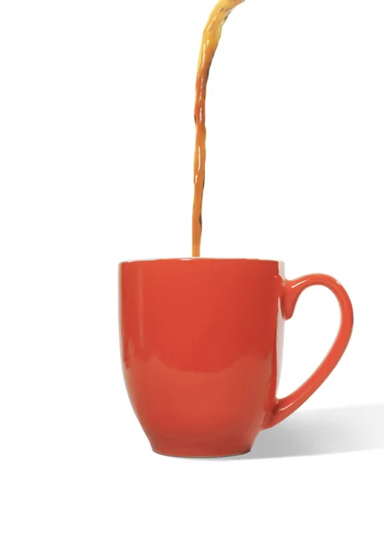 Café vertiendo en una taza Imagen de stock