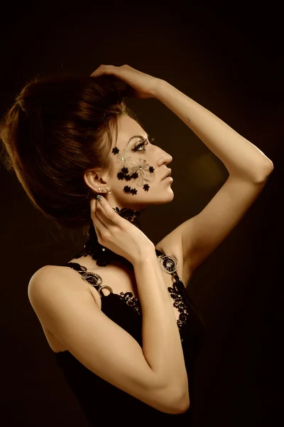 woman black lace flowers on face