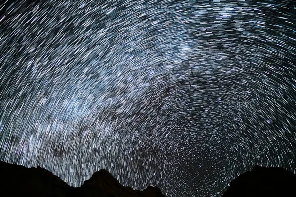 Star Trails of Polaris North Star and Milky Way Galaxy in Northwest Sky at 24mm Over Red Rock Canyon Astrophotography in California USA