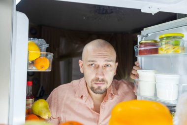 hungry man, Violation of the diet. A man looks at the refrigerator at night, a hungry man with a look is ready to eat everything, clipart