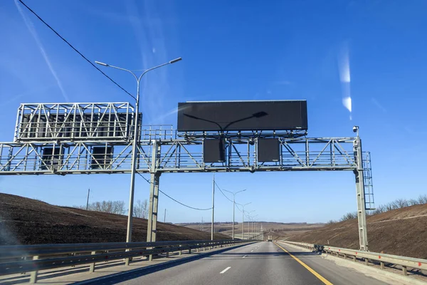 Camera speed control and information board on the road. Empty advertising and traffic information board over the road