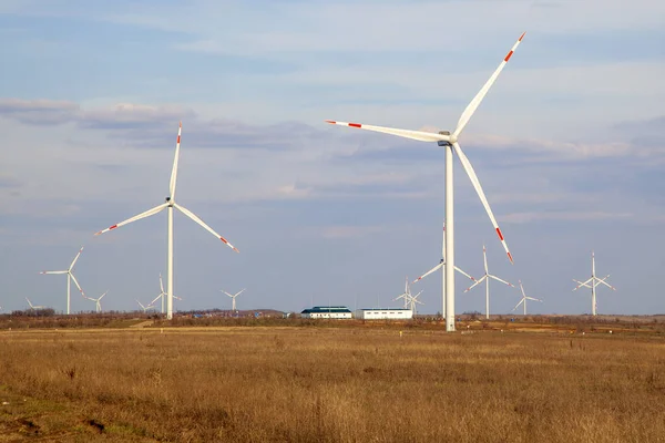 Energy. Wind turbines at dusk at sunset