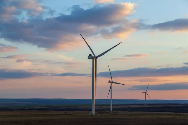 Energy. Wind turbines at dusk at sunset