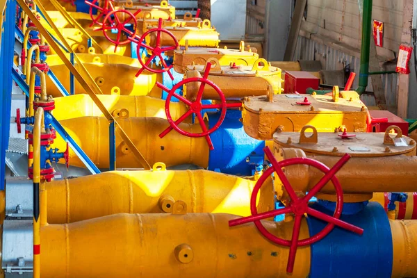 Oil, gas industry. gas conditioning equipment and valve armature. The gas pipeline is yellow with additional equipment, pipes and a valve to shut off the gas supply.
