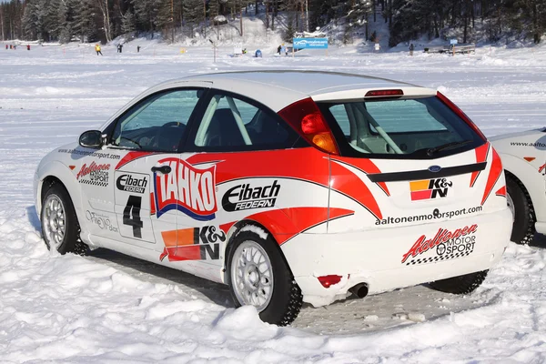 TAHKO, FINLAND - FEBRUARY 23, 2010: Stylish racing car Ford on studded tires for winter rally in Tahko, Finland — Stock Image TAHKO, FINLAND - FEBRUARY 23, 2010: Stylish racing car Ford on studded tires for winter rally in Tahko, Finland Royalty Free Stock Photos