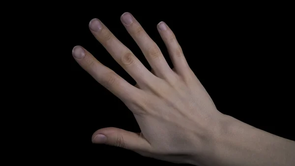 Рука на черном фоне — стоковое фото
