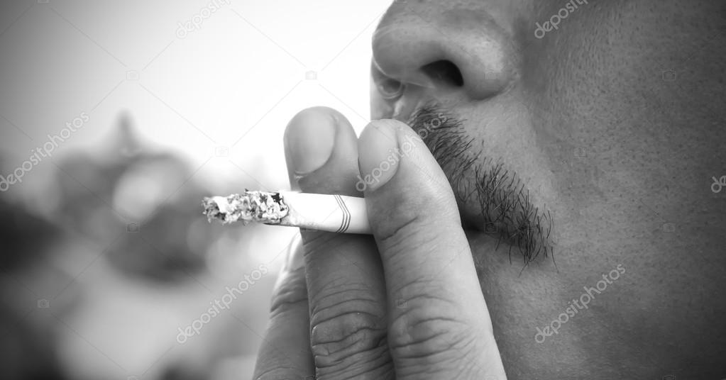 Smoking cigarette black and white.