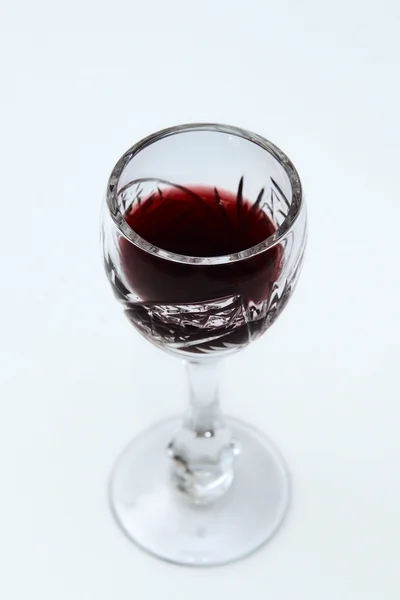 wine in a vintage wine glass on a light background