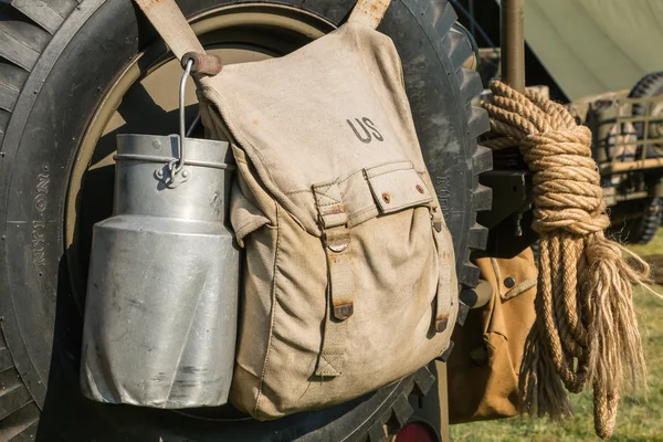 US military bag and gasoline jerrycan on a jeep expostion