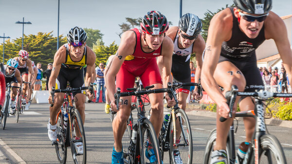 cyclists in acceleration during a road bike race