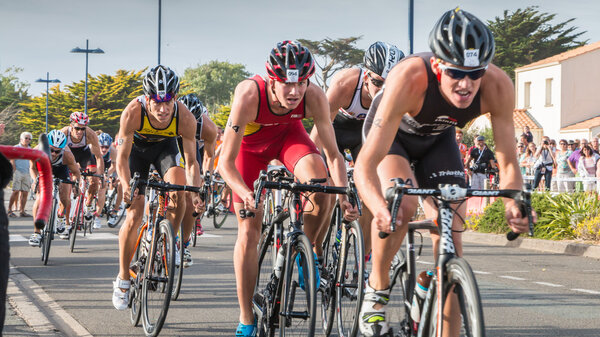 cyclists in acceleration during a road bike race
