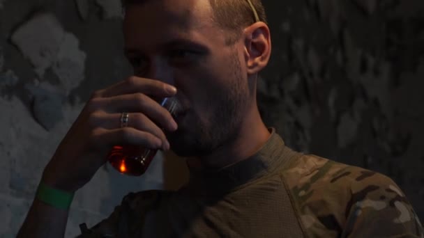 Man In the abandoned building resting, drinking tea and talking. — Stock Video