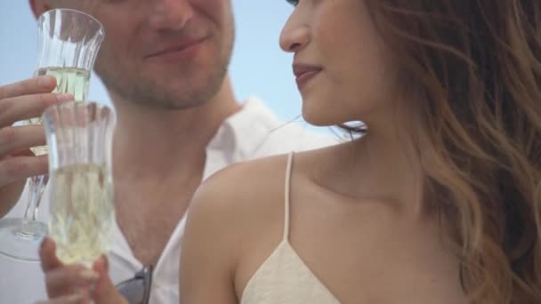 Woman and man drink champagne standing on yacht closeup — Stock Video