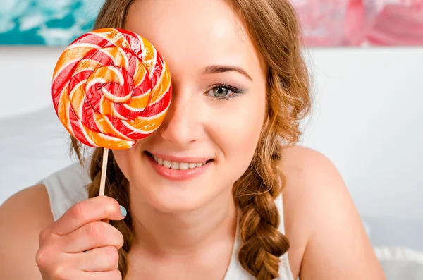 Portrait of a happy, cheerful, blonde young girl is holding a bi — Stock Photo, Image