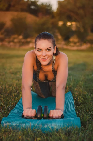 fitness, sport, training and people concept - smiling woman doin