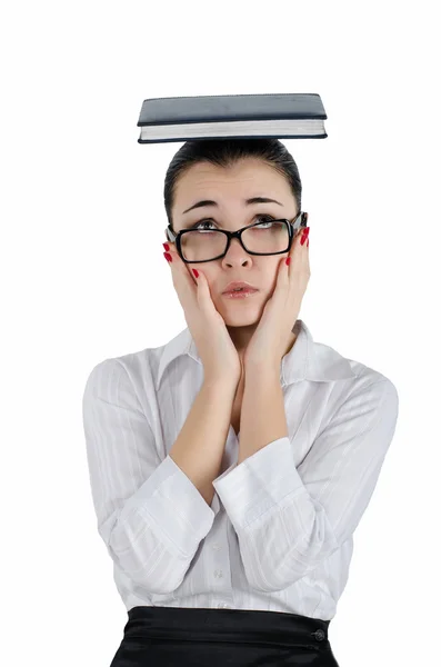 Tired, exhausted business woman holding a diary on his head with a lot of cases Stock Picture