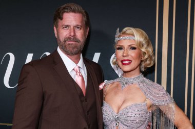 Slade Smiley and wife/American television personality Gretchen Rossi arrive at the 2nd Annual Gurus Awards Presented by Gurus Magazine held at Cicada Restaurant and Lounge at Oviatt Building at The Olive on October 12, 2025 in Los Angeles, California