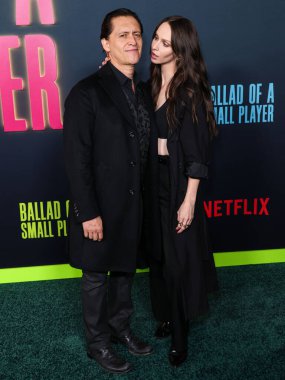 American actor Clifton Collins Jr. and American actress Bailee MyKell Cowperthwaite arrive at Los Angeles Special Screening Of Netflix's 'Ballad Of A Small Player' held at Egyptian Theatre Hollywood on October 14, 2025 in Hollywood, CA, LA, USA.